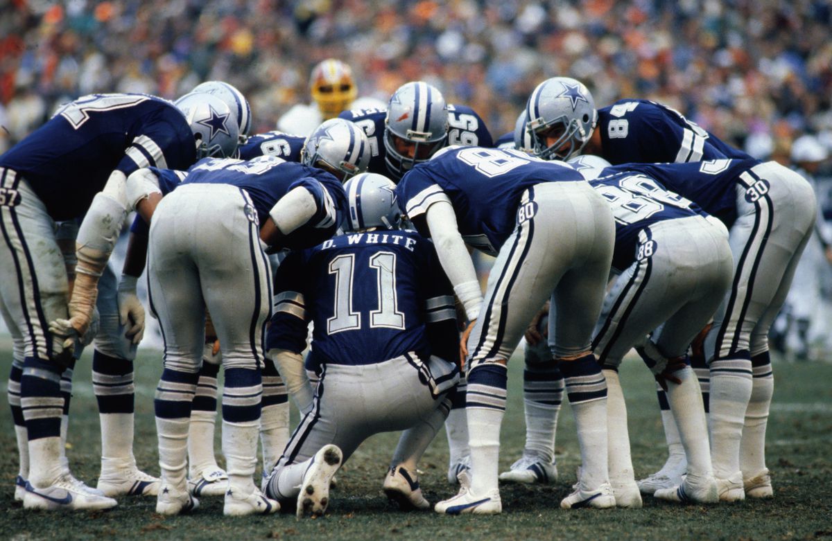 Danny White Calling Signals in Huddle